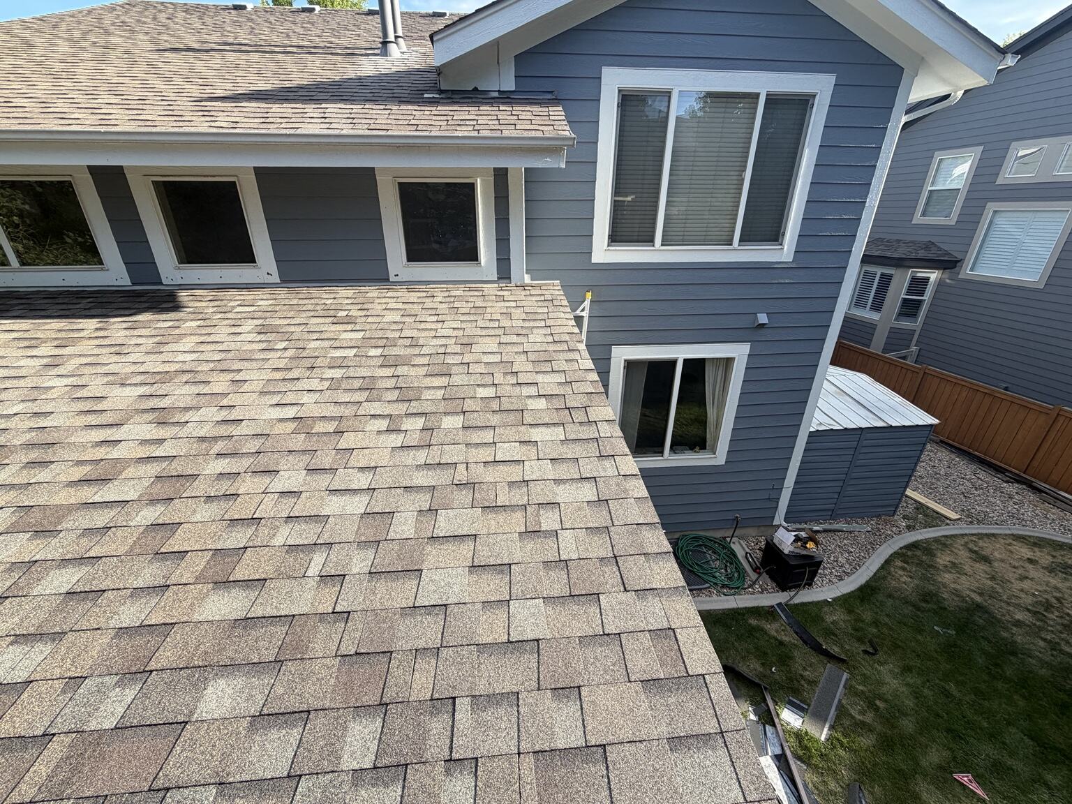 Close view of patio-cover shingles and roof integration