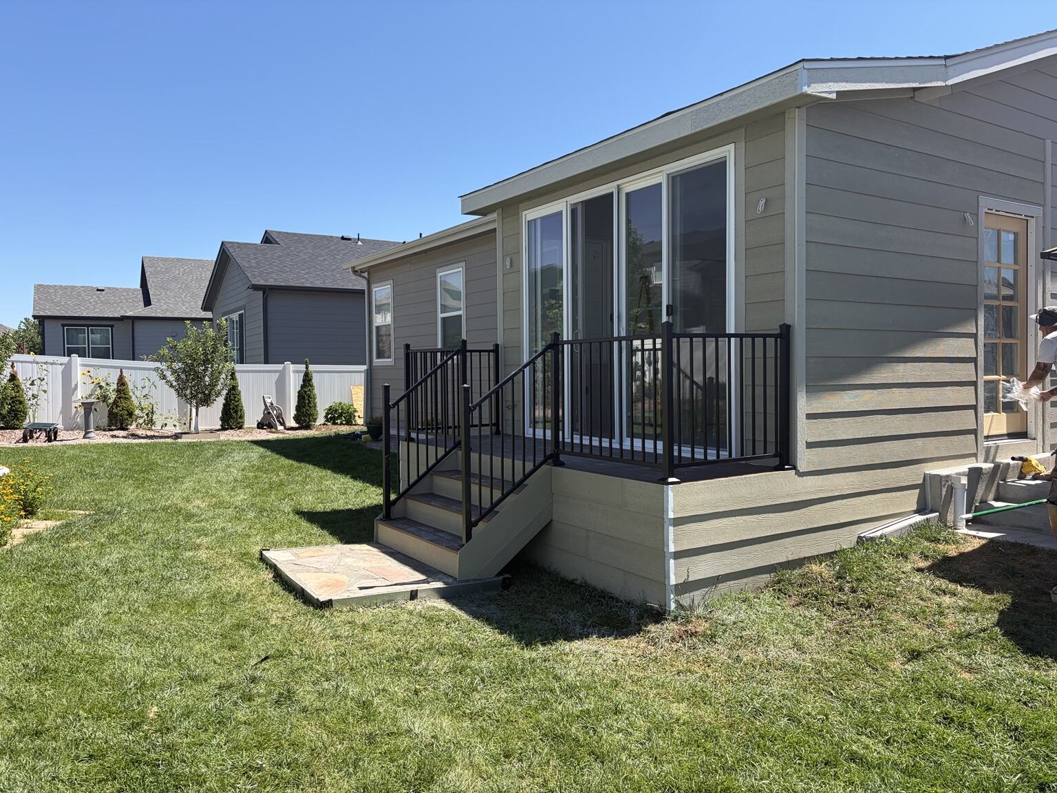 Corner view of finished three-season room and railings
